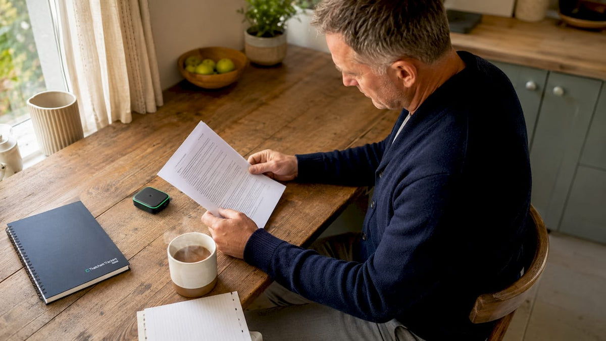 UK vehicle owner reviewing insurance policy and tracker