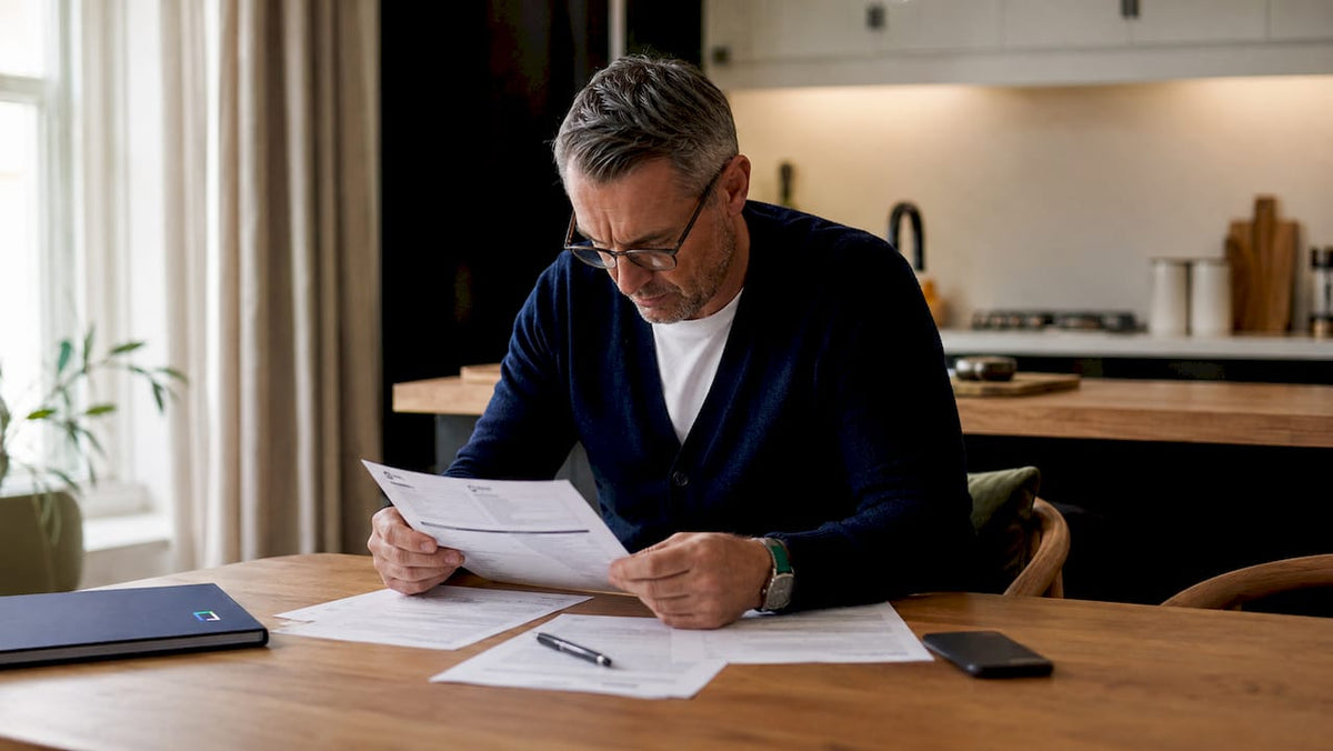 Man reviewing car tracker installation certificate